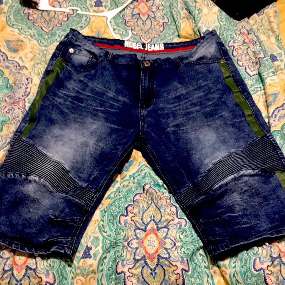 I’m selling denim shorts with a green strip